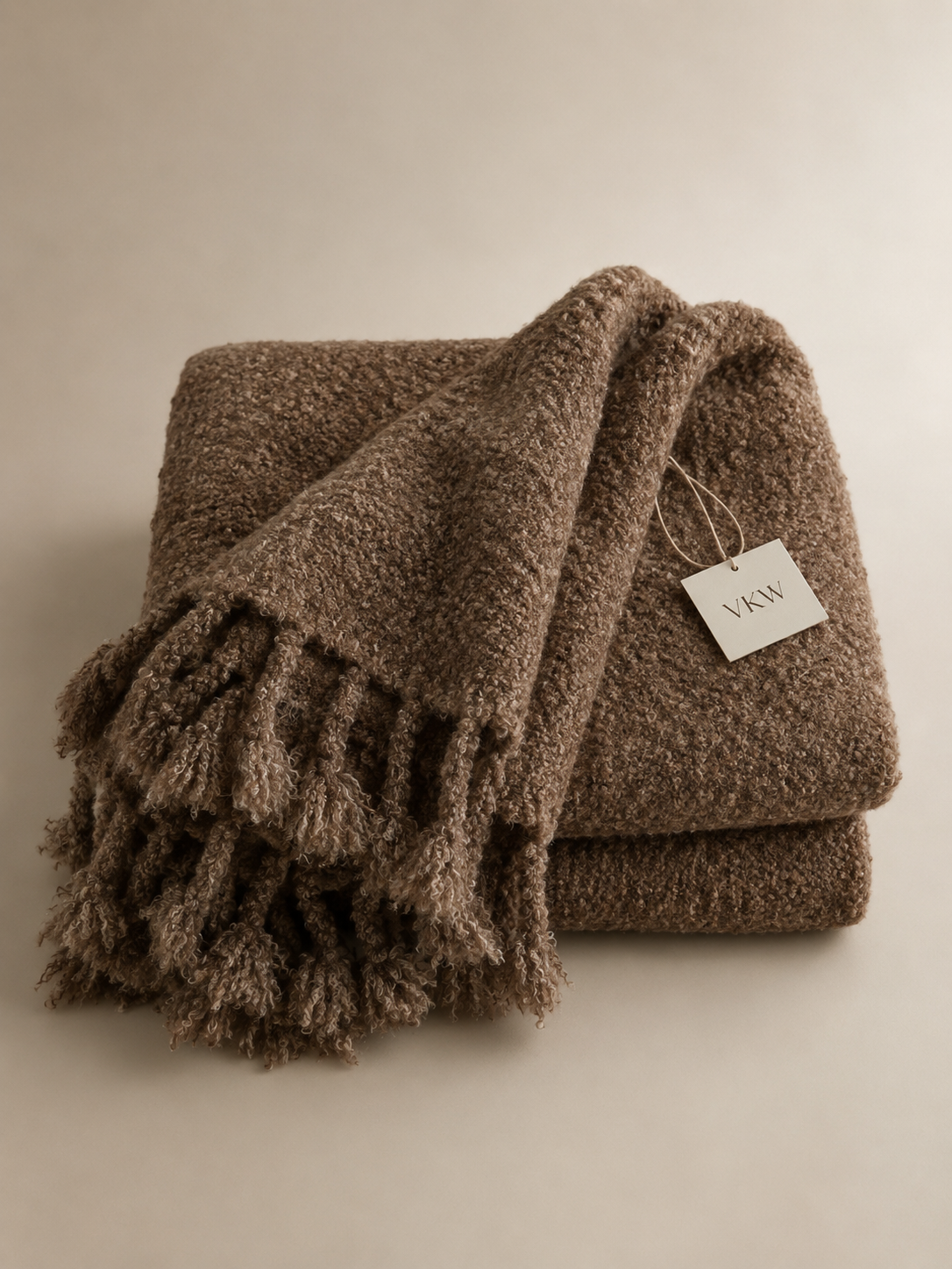 Boucle teppe melert brun